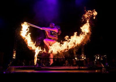 Cabaret performers dancing with fire at a London event